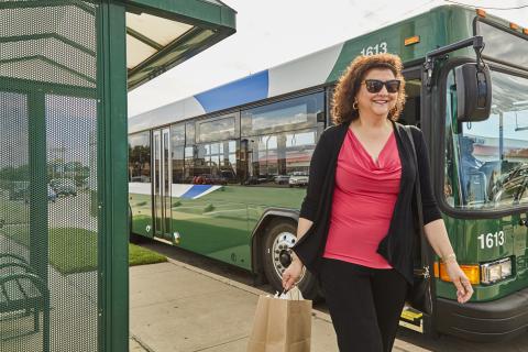Woman Getting off Bus