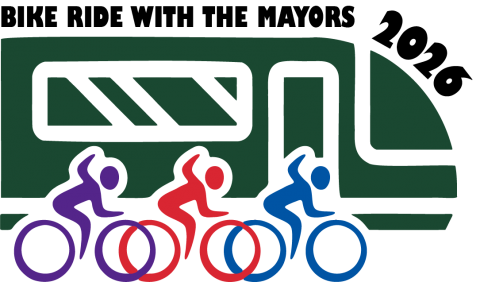 Bike with the Mayors 2026 logo with green train icon and three bikers waving at the train icons in purple, red and blue